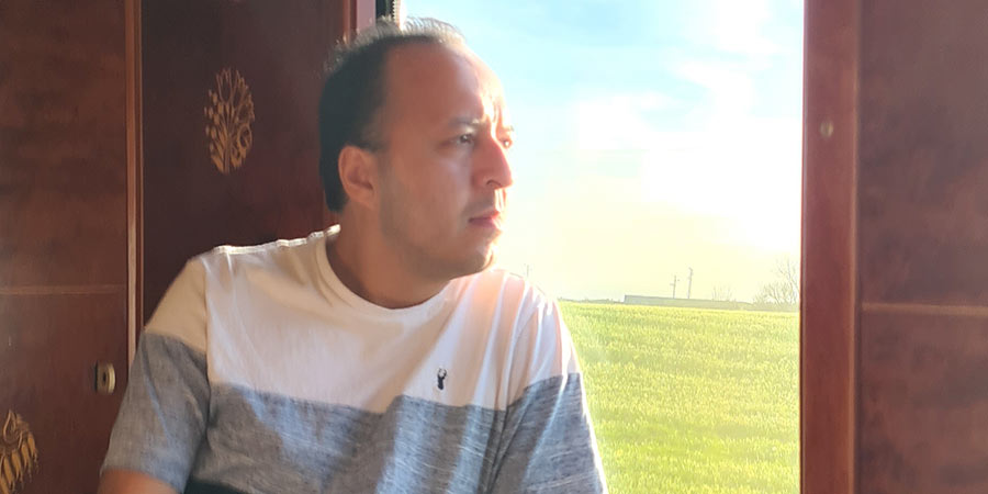 James enjoys the view from his cabin onboard the Al Andalus.